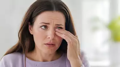 User experiencing dry eyes with a concerned expression
