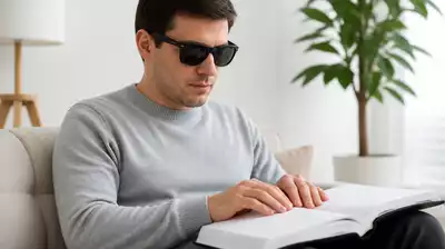 User with visual impairment engaged in reading